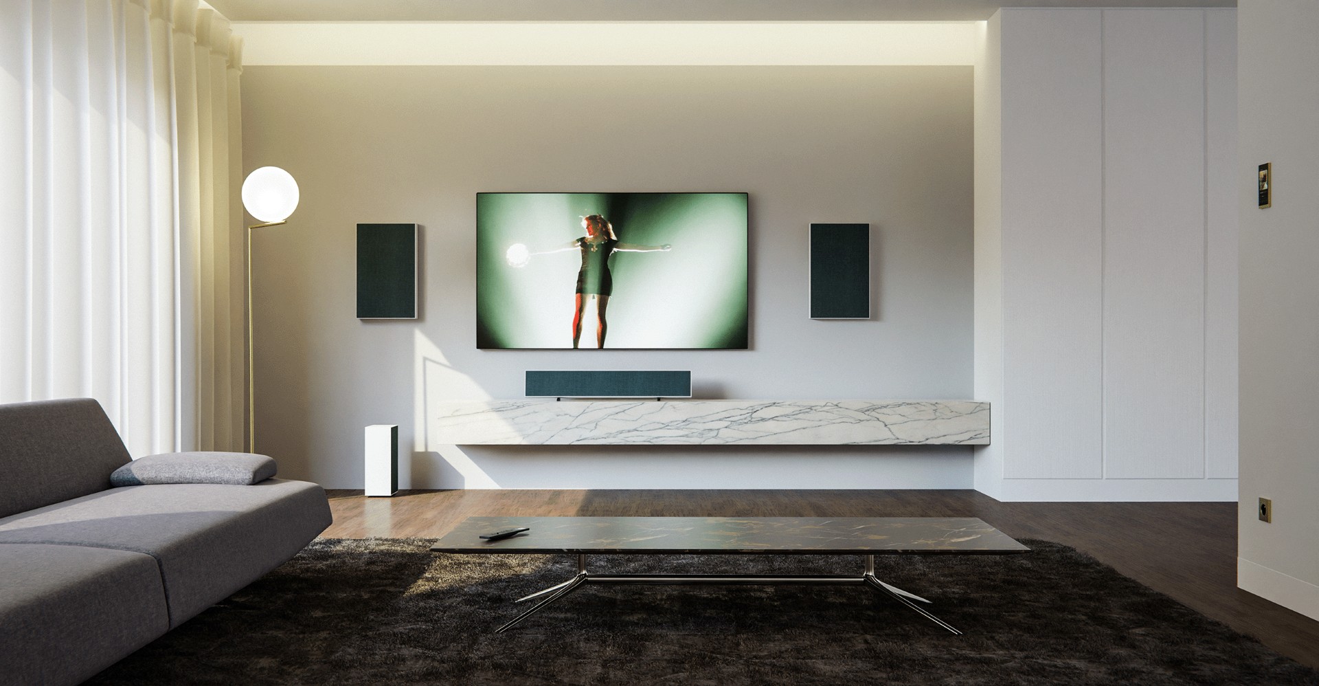 Wohnzimmer-Setup mit Basalte Aalto Stereo/Kino-Lautsprechersystem und Basalte Ellie Touchpanel rechts an der Wand